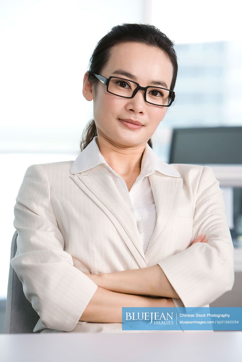 Chinese office worker at her desk