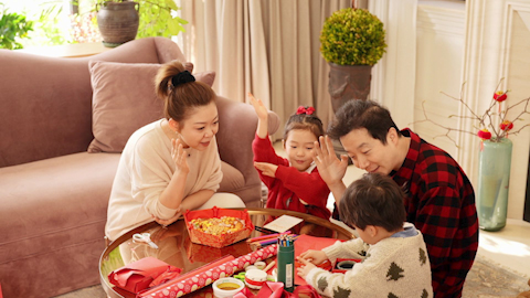 Family joyfully celebrating Chinese New Year together