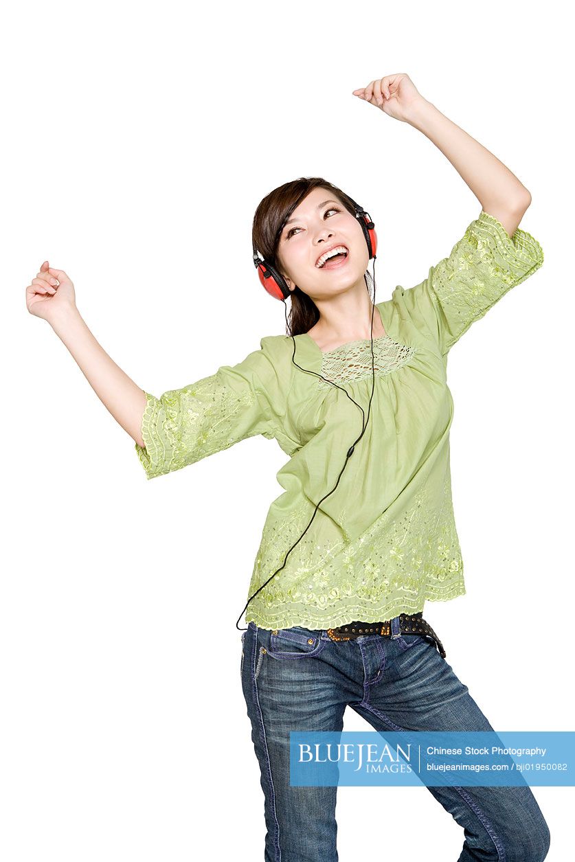 Portrait of young Chinese woman with headphones