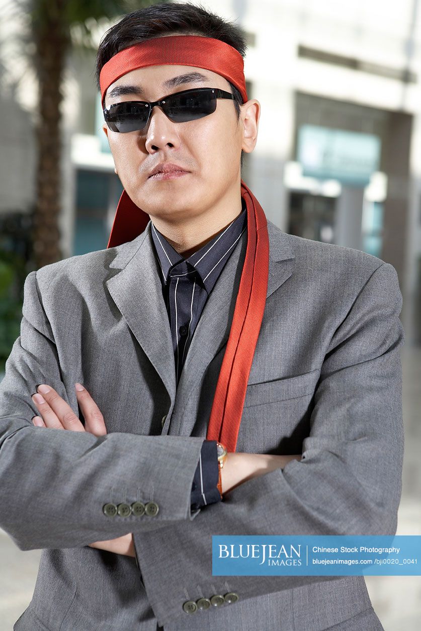 Chinese businessman in sunglasses and headband