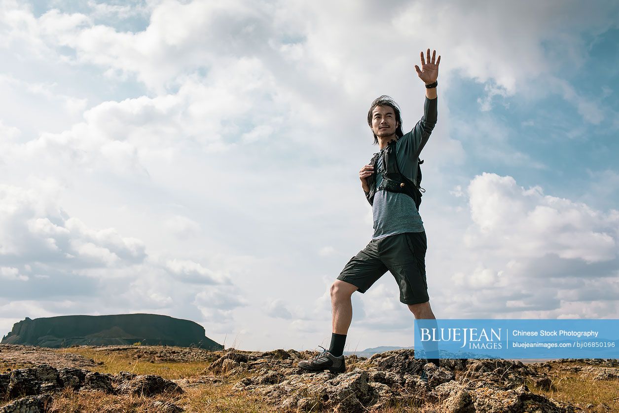 Chinese male trail runner training in nature