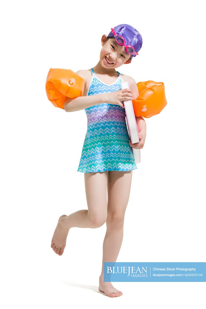 Cute little girl in swimsuit hi-res stock photography and images