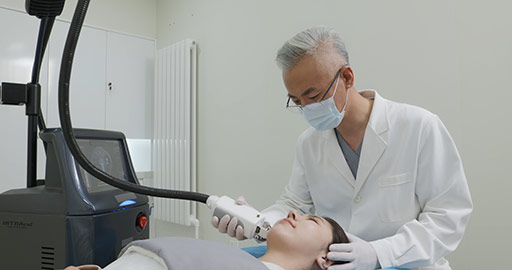 Young Chinese woman receiving face treatment in hospital,4K