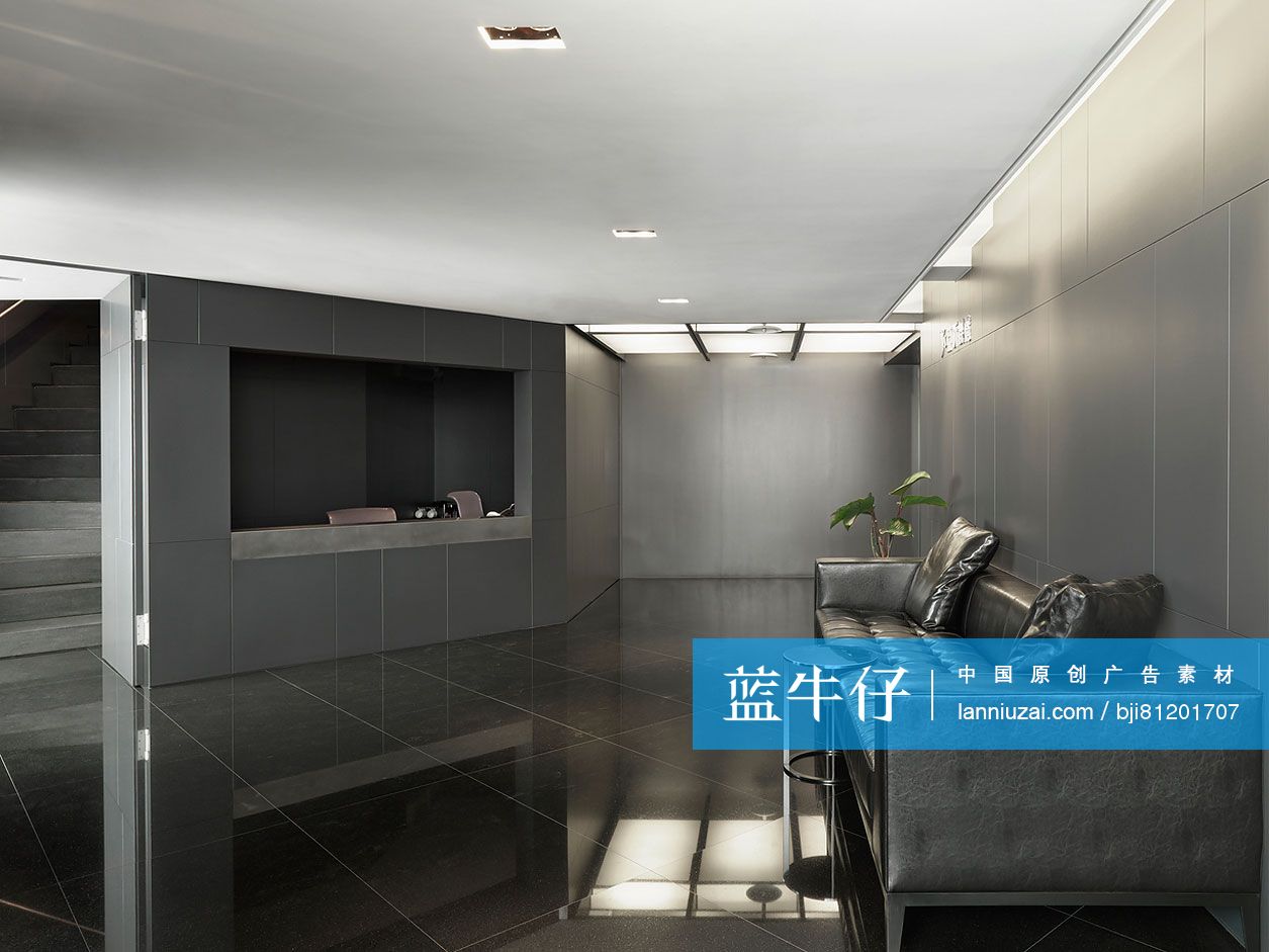 Black leather sofa in modern office lobby