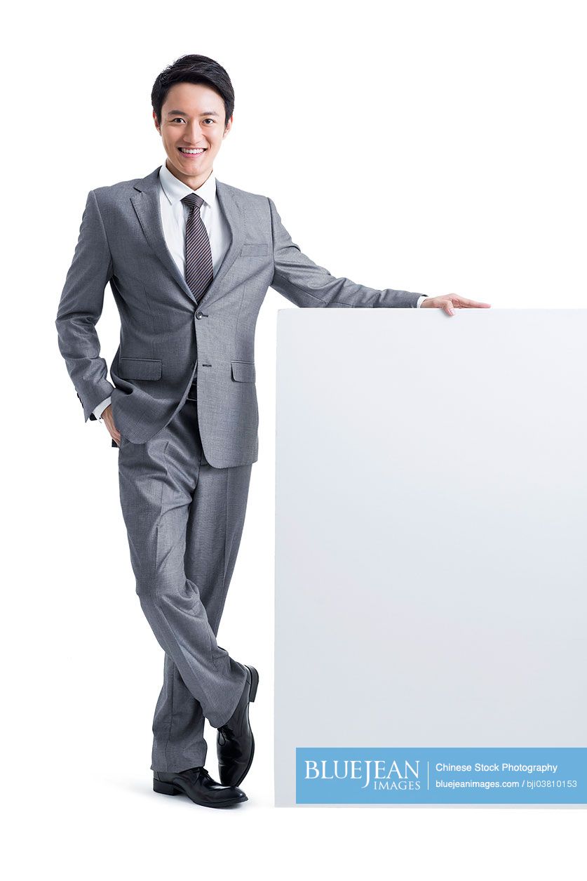 Young Chinese businessman with whiteboard