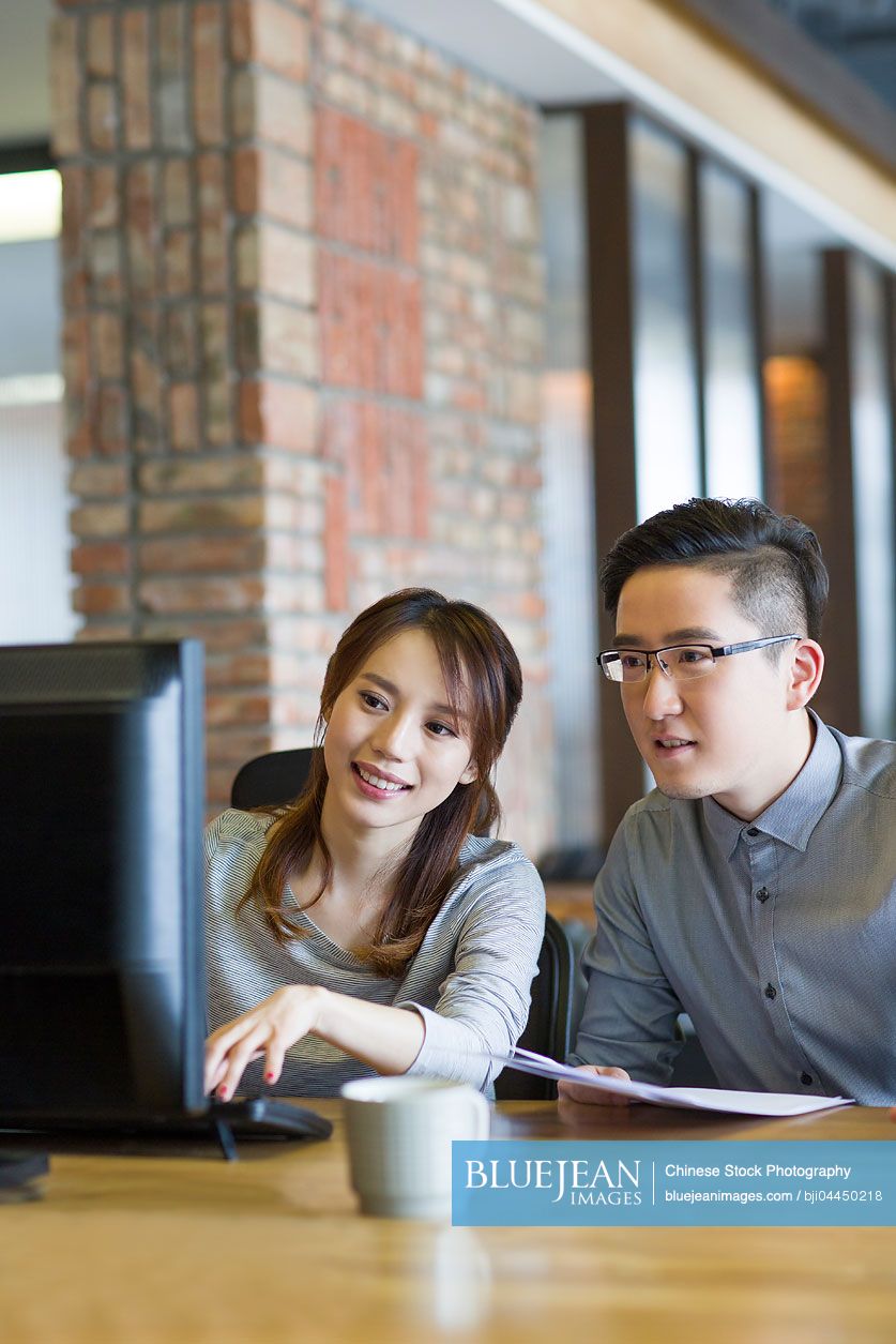 Chinese IT workers working in office