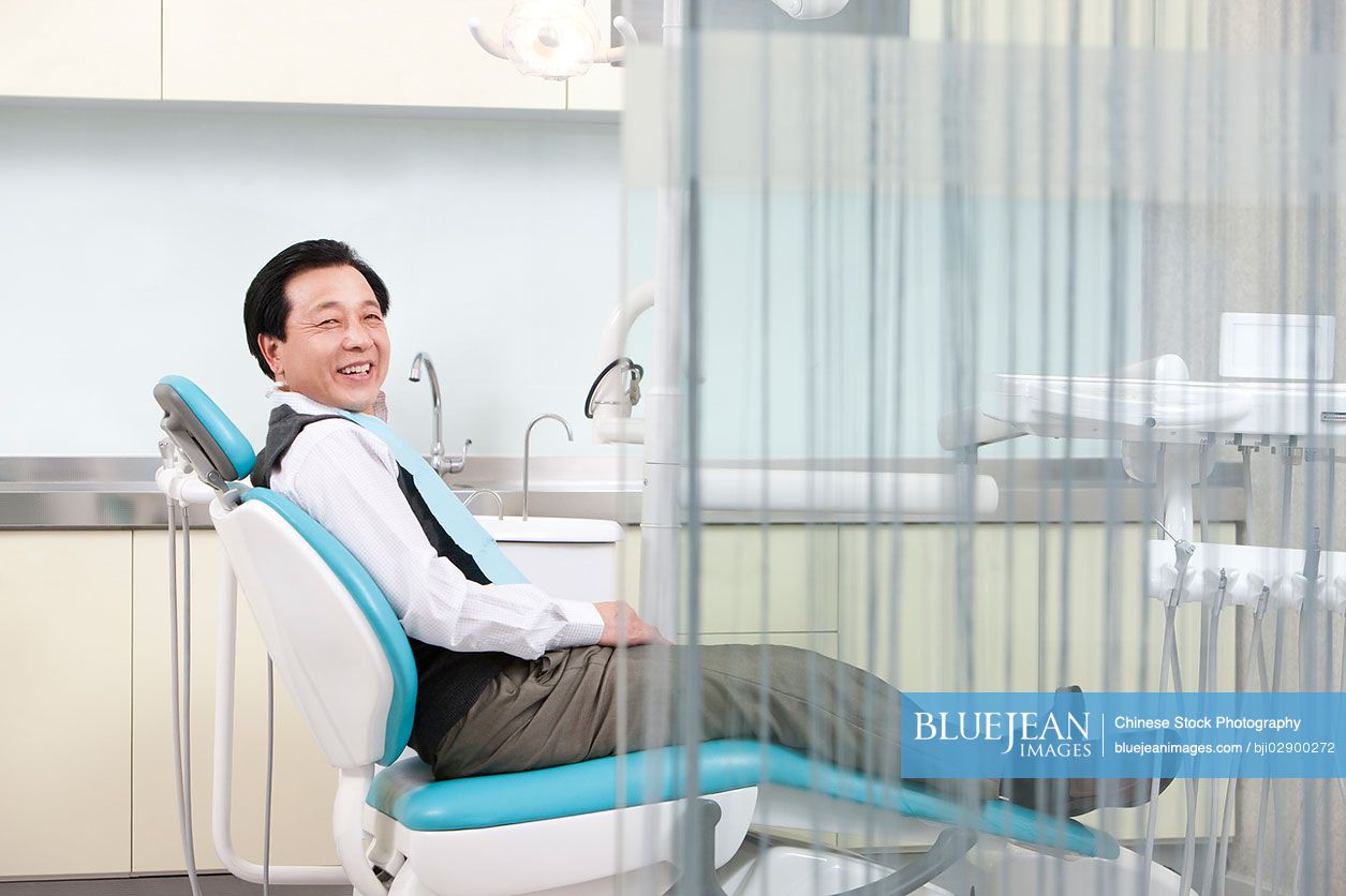 Senior Chinese patient in dental clinic