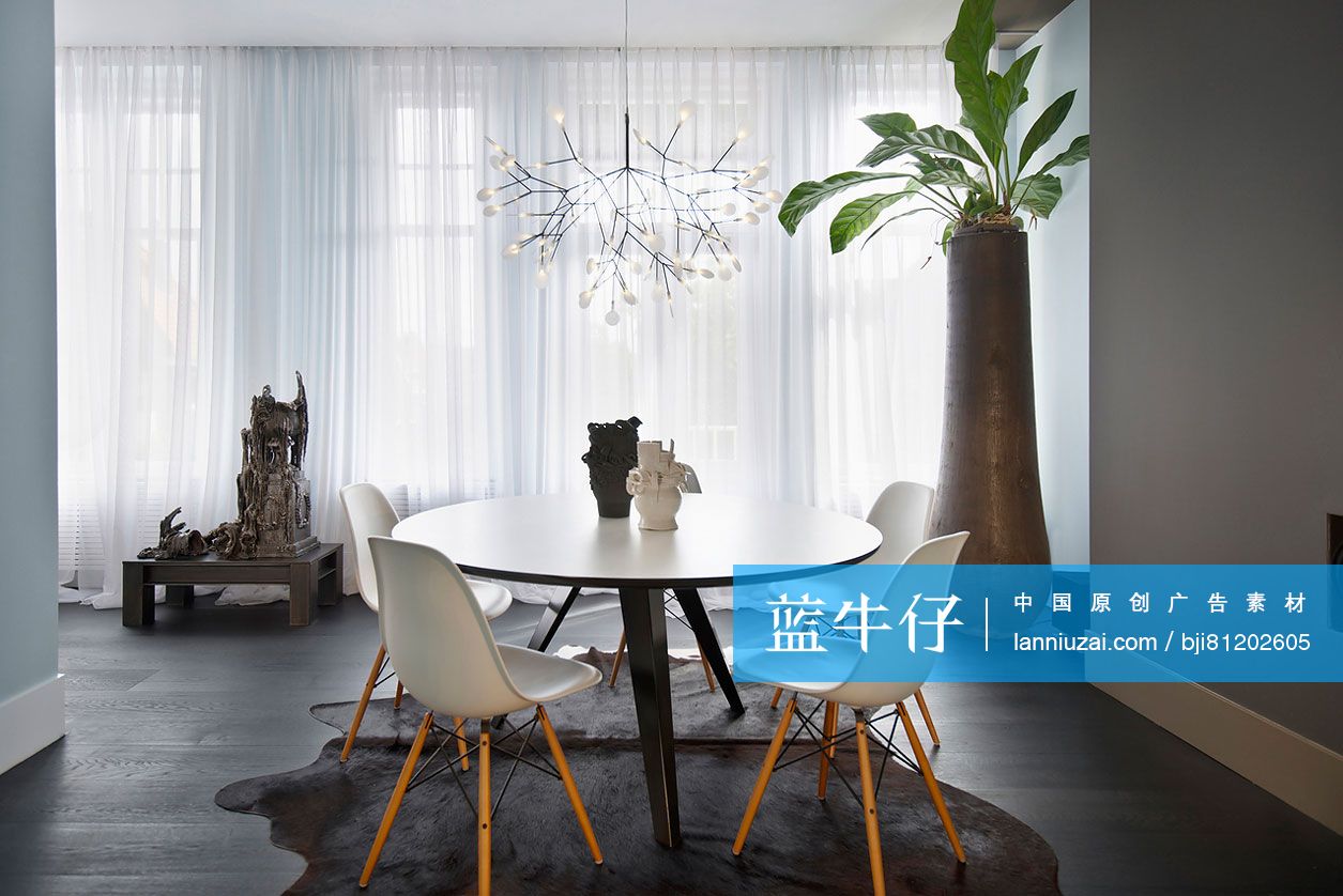 Elegant chandelier over table and chairs in modern dining room