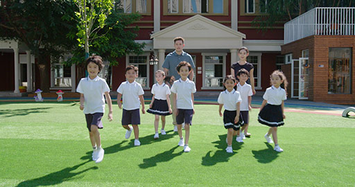 Teachers and students in kindergarten playground,4K