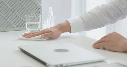 Young Chinese businessman using disinfectant in office,4K