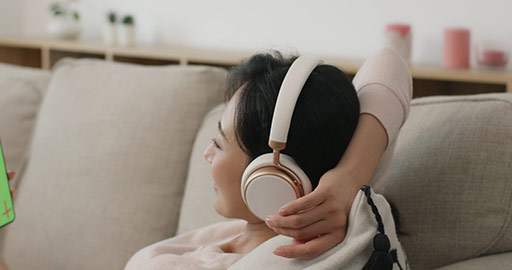 Happy young Chinese woman listening to music,4K