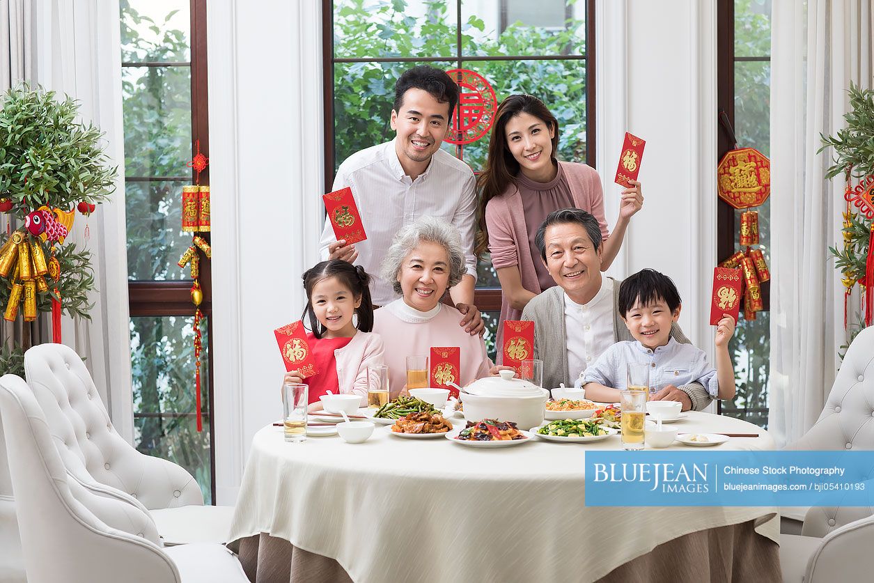 Happy family having Chinese New Year dinner