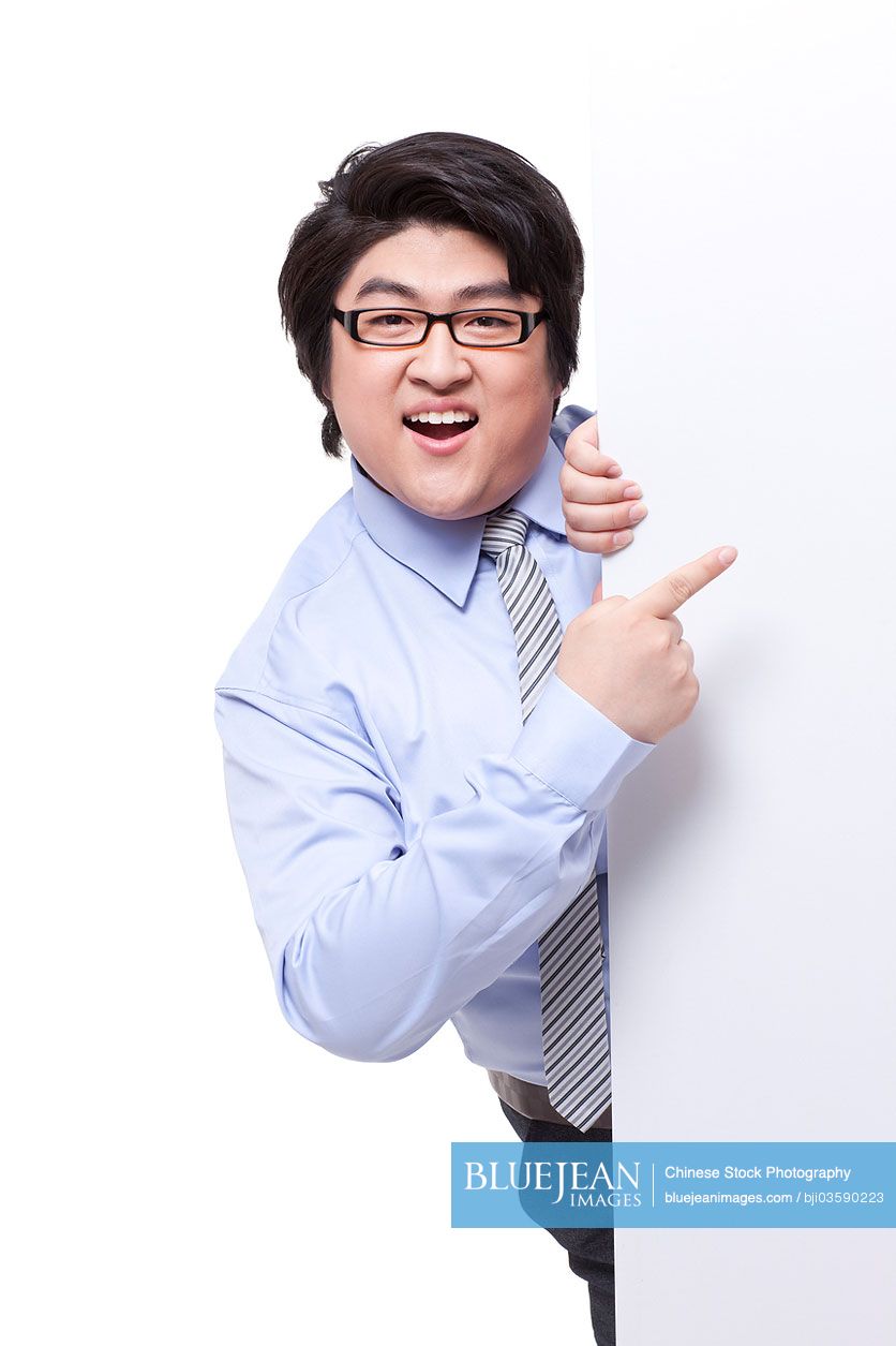 Overweight businessman with whiteboard