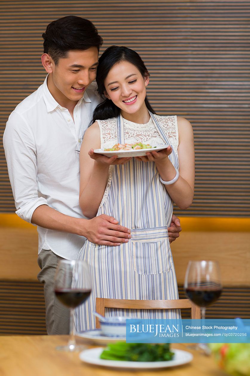 Young Chinese couple enjoying dinner