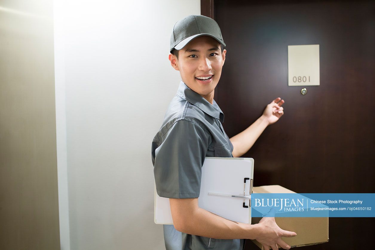 Chinese delivery person delivering package