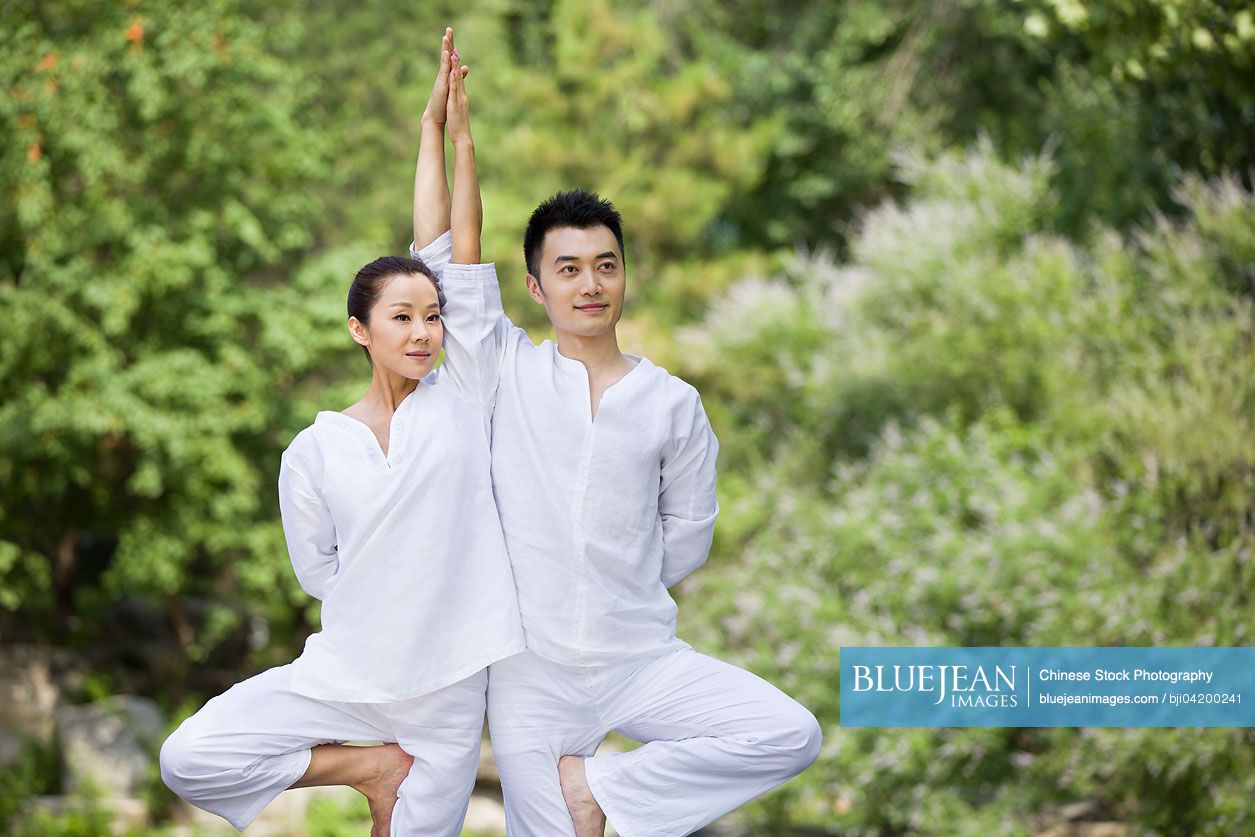 Young Chinese adult practicing yoga