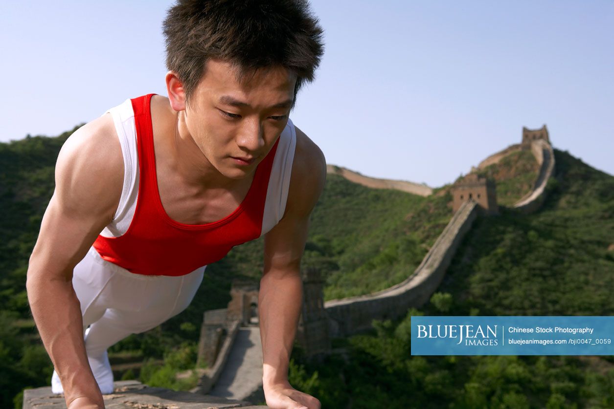 Chinese Gymnast Doing Push Up On The Great Wall Of China