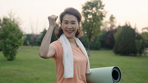 Happy senior Chinese woman exercising in park,4K