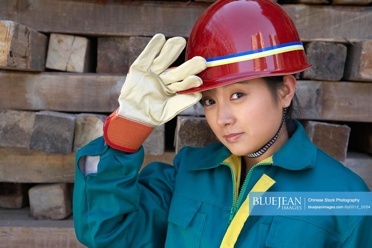 Chinese worker wearing hard hat in construction site