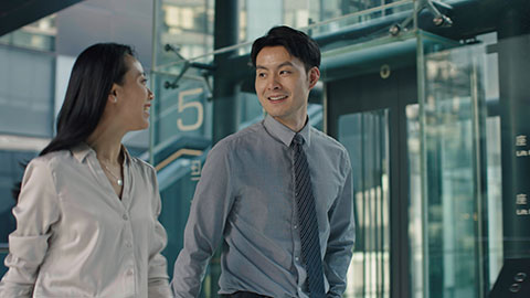 Confident Chinese business people walking in office building,4K