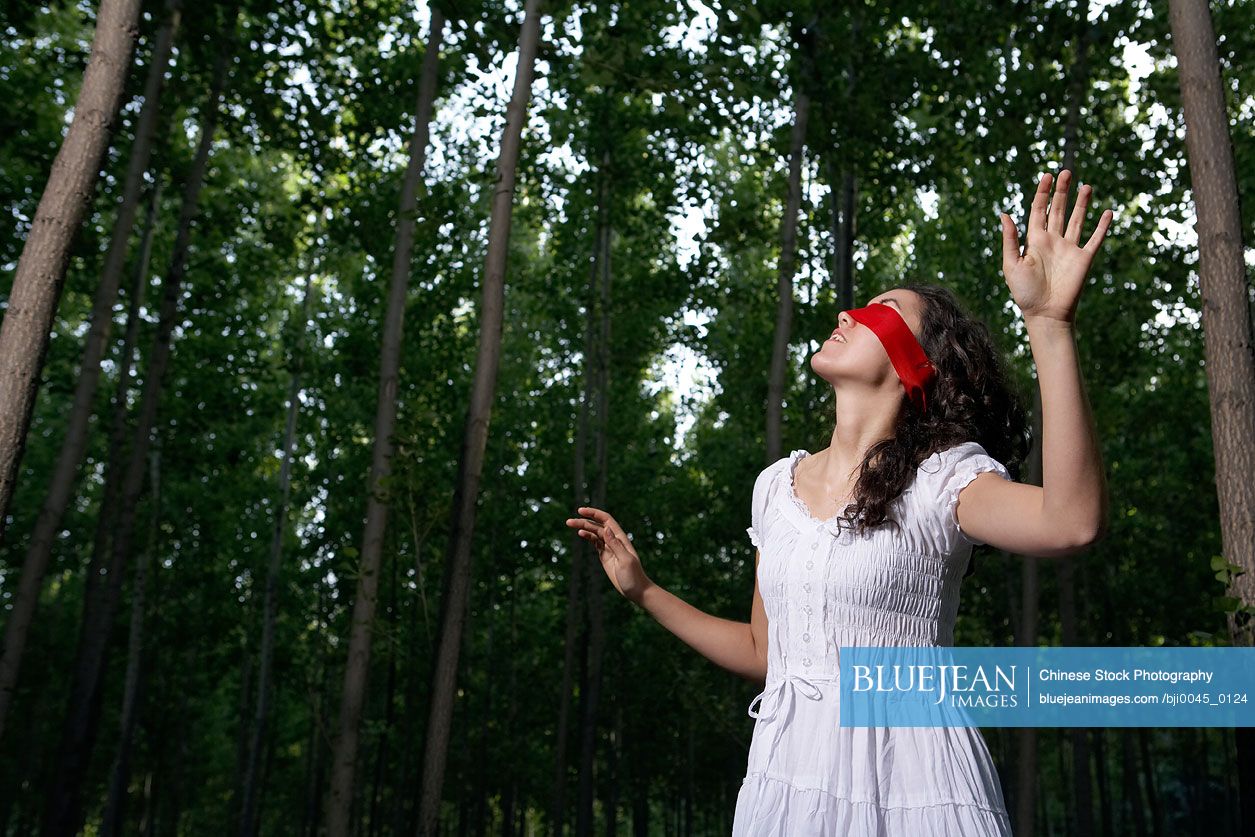 Chinese Woman Walking In Forest Blindfolded