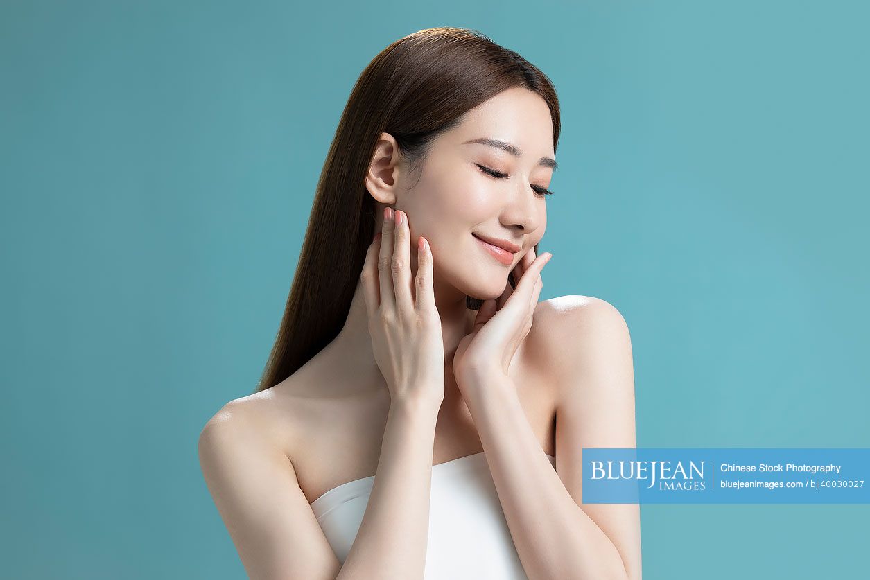 Studio shot of beautiful young Chinese woman