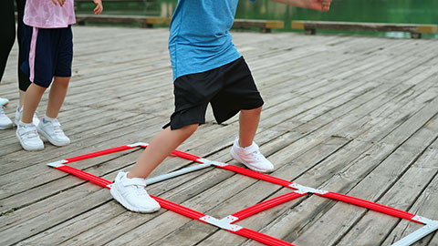 A young family works out in the park, staying active and healthy