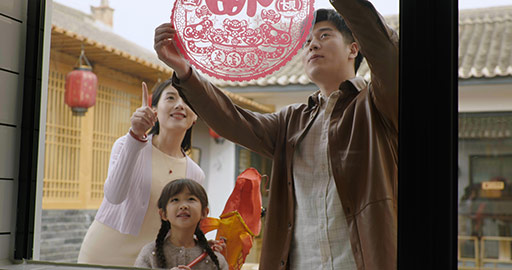 Happy family decorating their house for Chinese New Year,4K