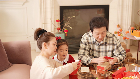 Family joyfully celebrating Chinese New Year together