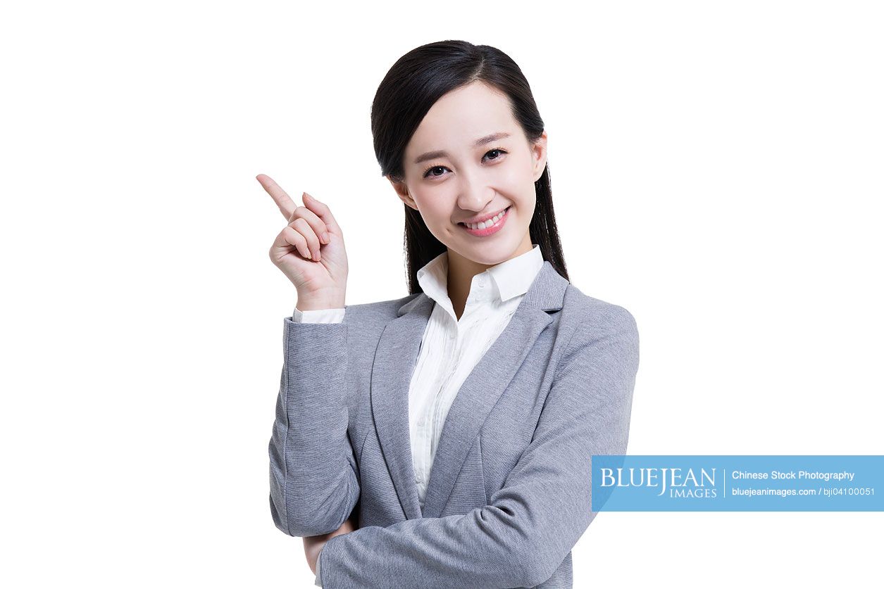 Happy Chinese businesswoman raising her finger