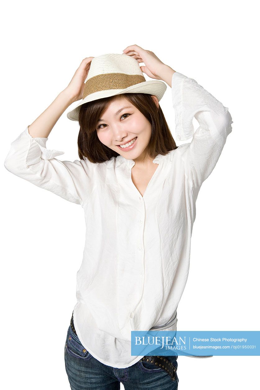 Portrait of young Chinese woman with hat