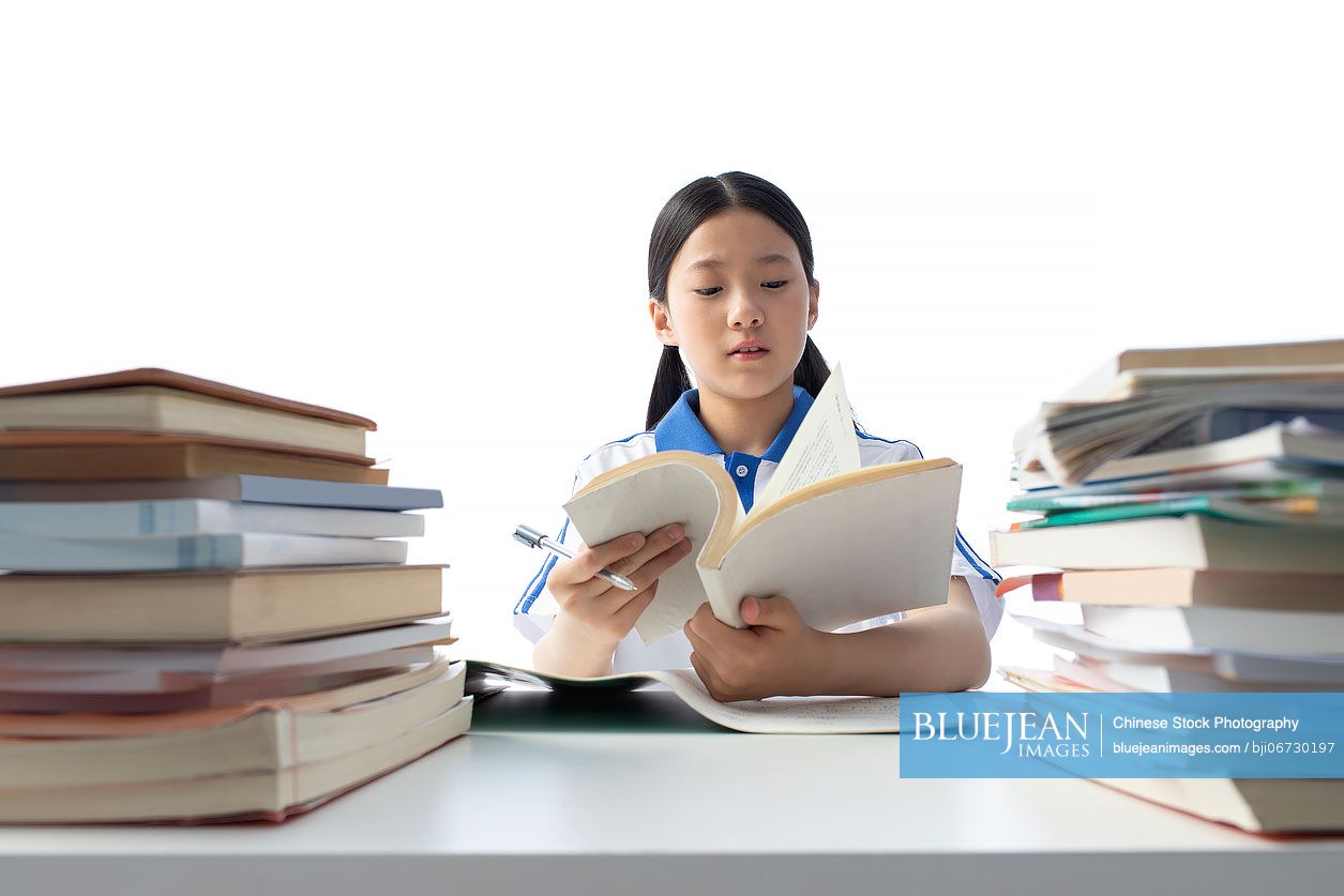 Chinese teenage girl doing homework