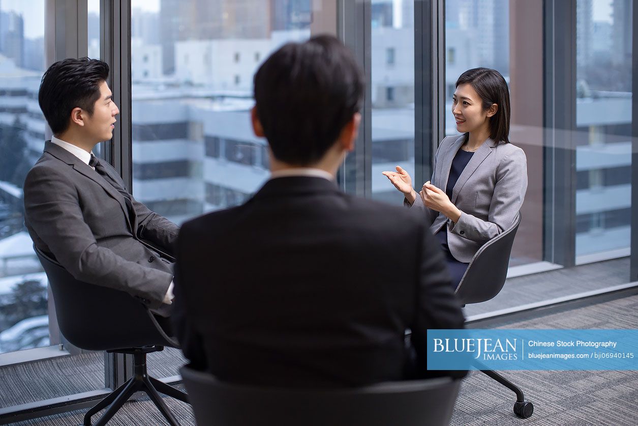 Confident Chinese business people having a meeting