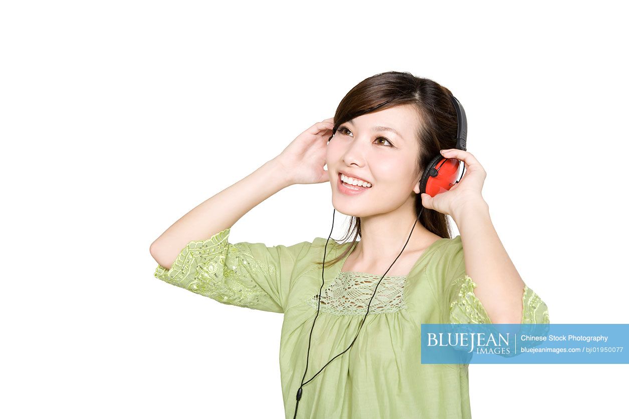 Portrait of young Chinese woman with headphones