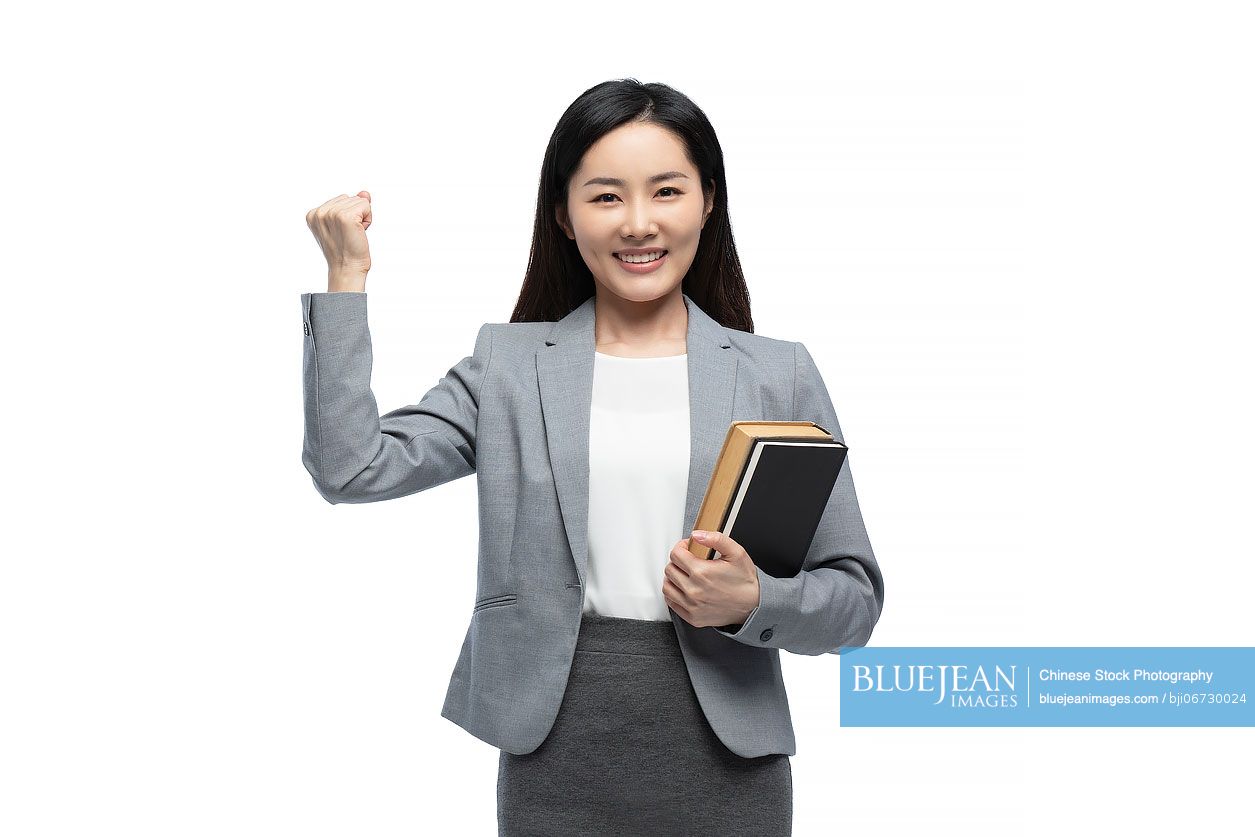 Happy Chinese female teacher cheering