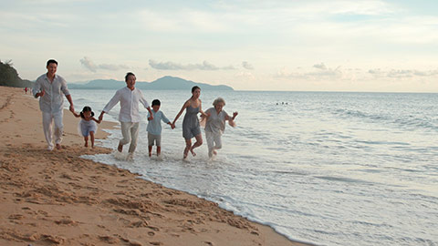 Happy Chinese family running on beach,4K