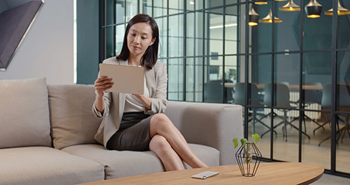 Chinese businesswoman using digital tablet in office,4K