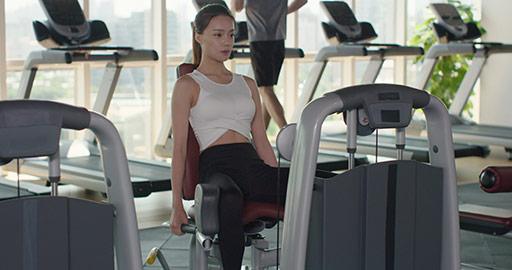 Young Chinese woman exercising at gym,4K