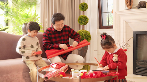 Family joyfully celebrating Chinese New Year together