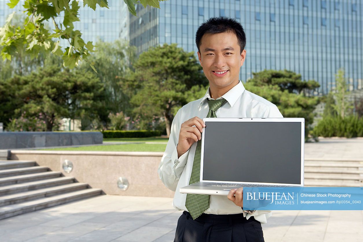 Chinese businessman with a laptop