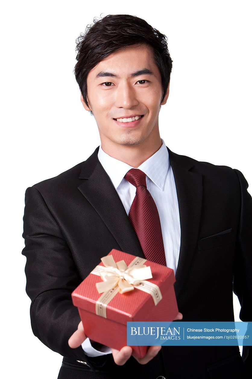 Chinese businessman holding a gift