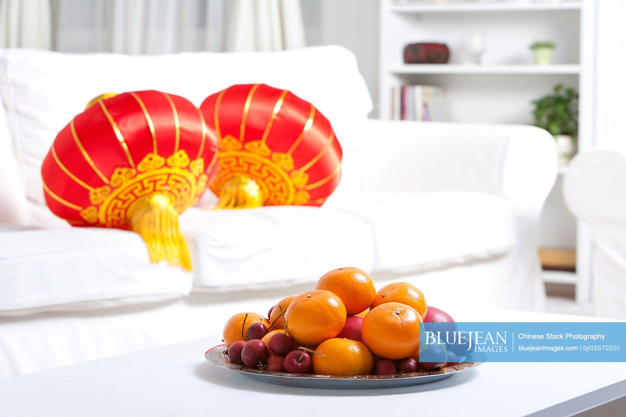 Bowl of fruit and lanterns to celebrate Chinese New Year
