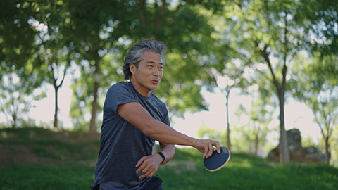 Chinese man playing table tennis ball