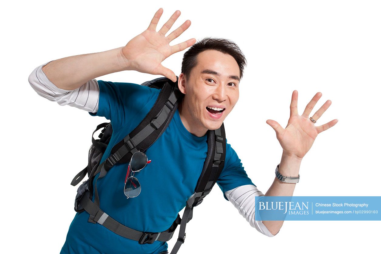 Portrait of young Chinese man travelling