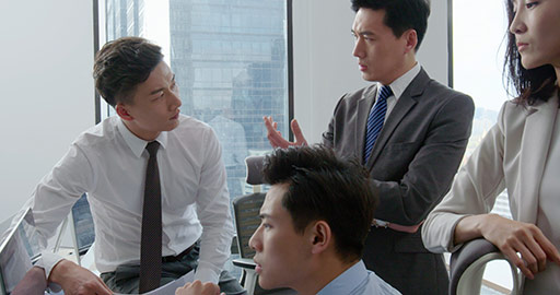 Confident Chinese business people talking in office,4K