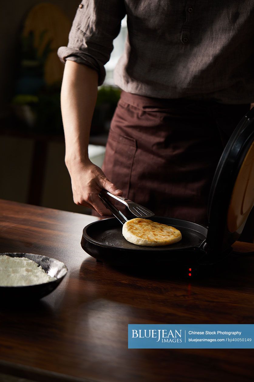 Chinese cook making wheaten food