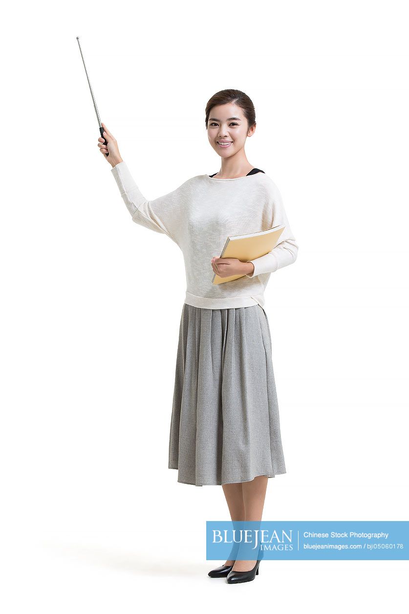 Young female Chinese teacher holding teacher's pointer