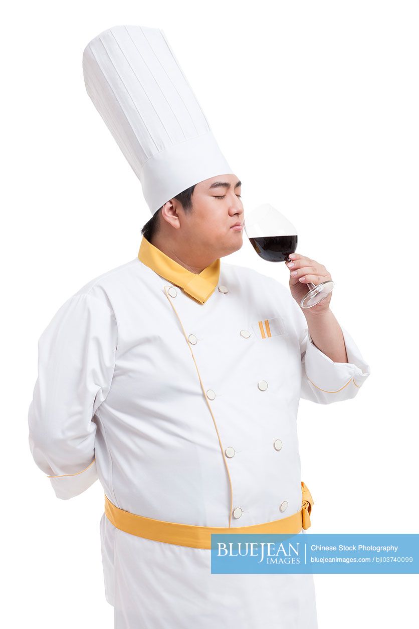 Chubby Chinese cook tasting wine