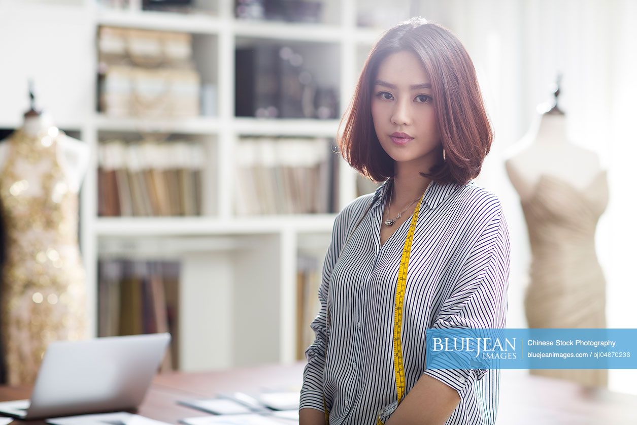 Portrait of female Chinese fashion designer