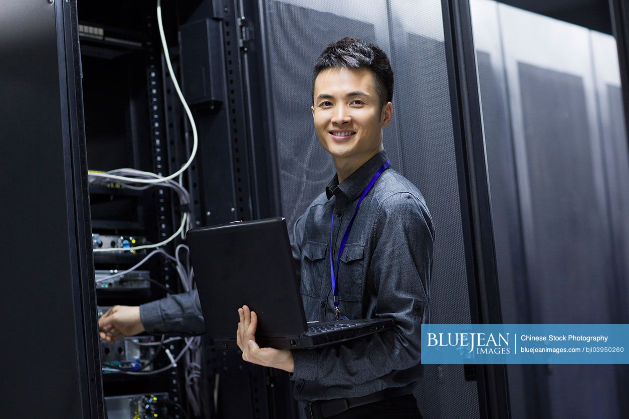 Technician doing maintenance in computer room